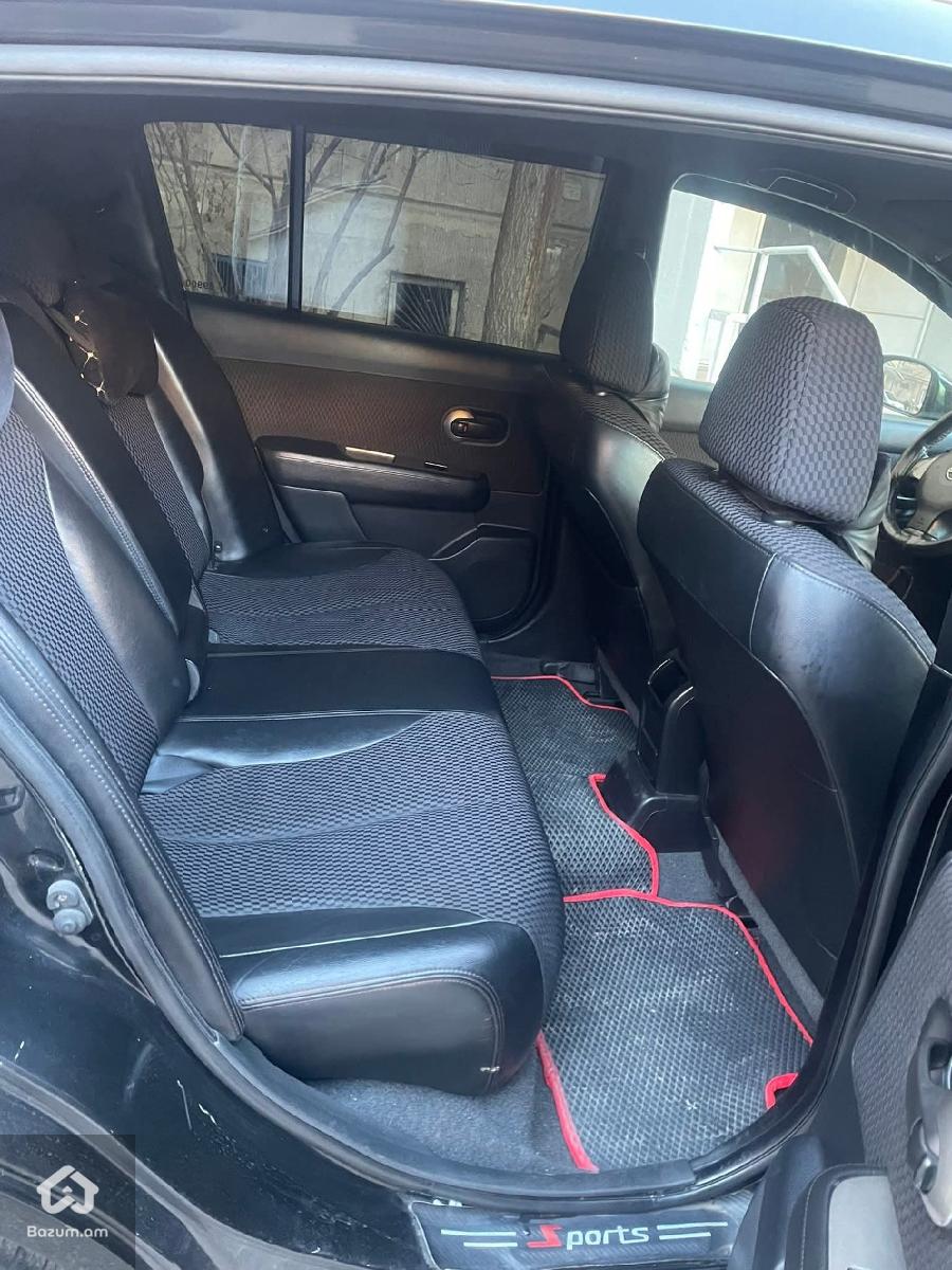 nissan tida - image 6